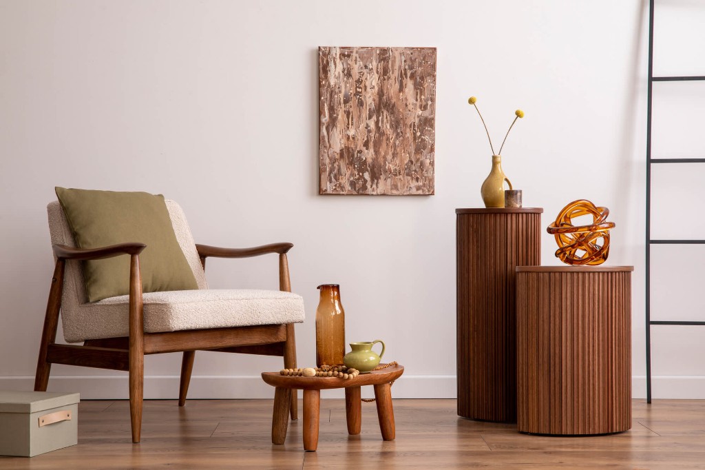 Living space featuring fluted wood tables and fine furniture craftsmanship